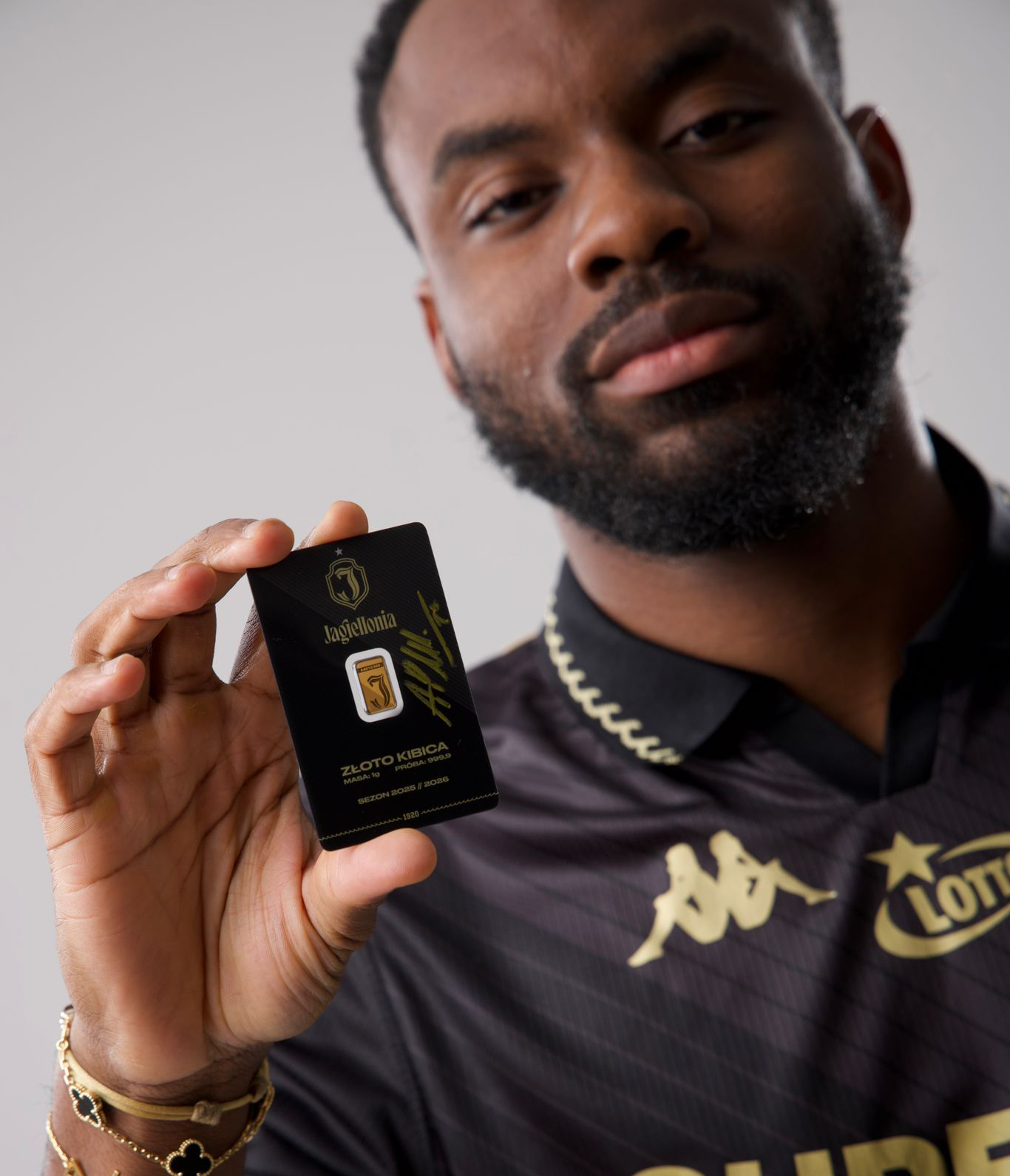 close-up macro shot of serial number AA137/500 engraved on gold bar, detailed texture