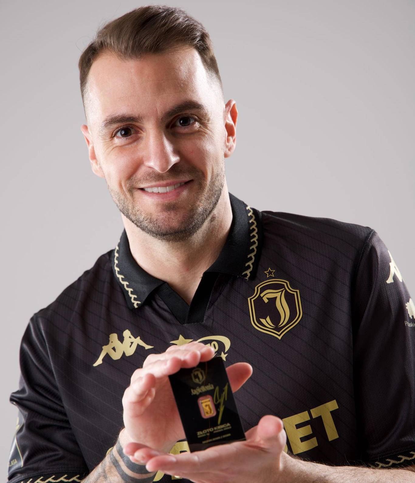 close-up macro shot of serial number AA137/500 engraved on gold bar, detailed texture