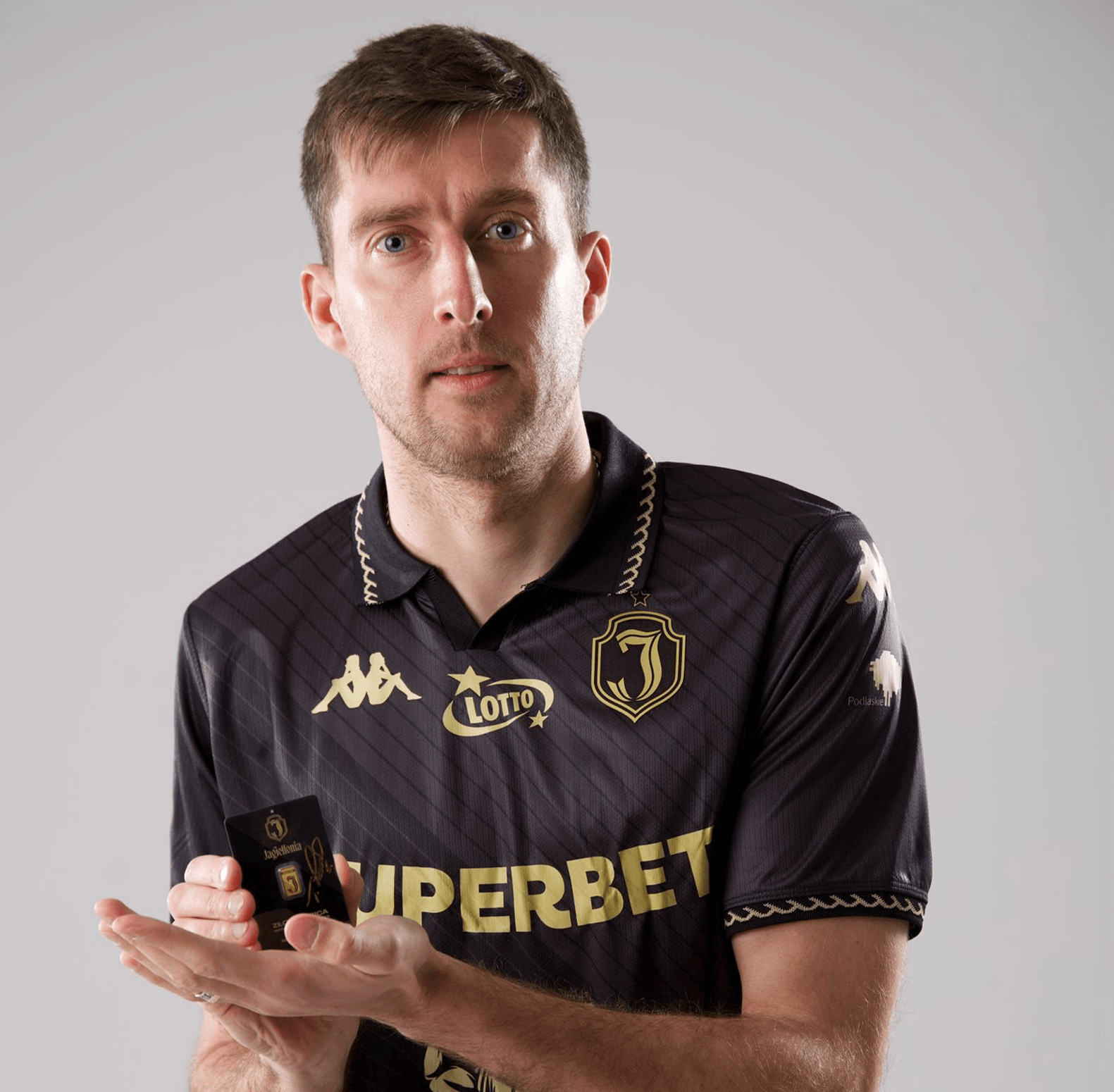 close-up macro shot of serial number AA137/500 engraved on gold bar, detailed texture