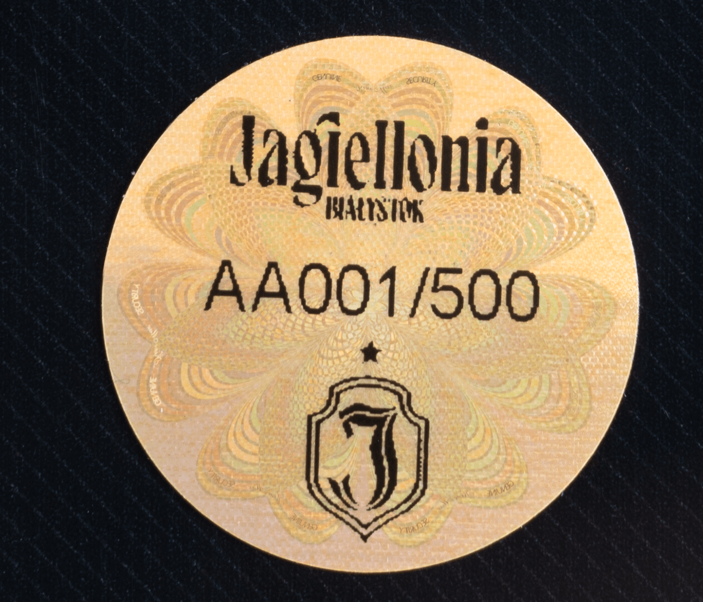 gold bar back view with serial number AA137/500 engraved, close-up detail shot